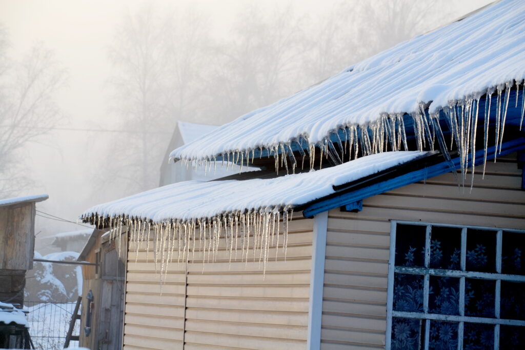 Ice Dam On Shingle Roof In Michigan Potentially Causing Roof Leaks